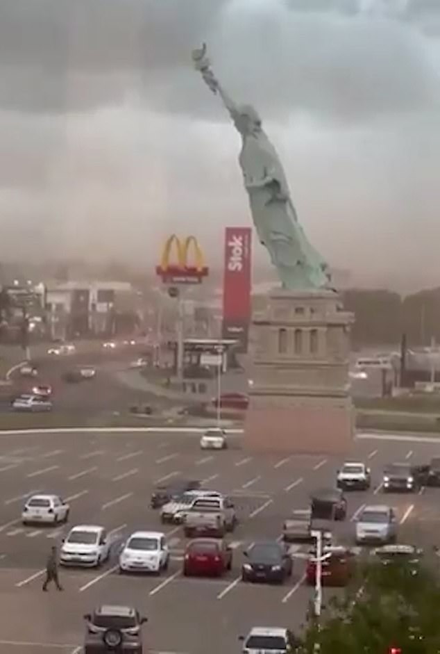 110ft Statue of Liberty replica comes crashing down as huge winds hit Brazilian city