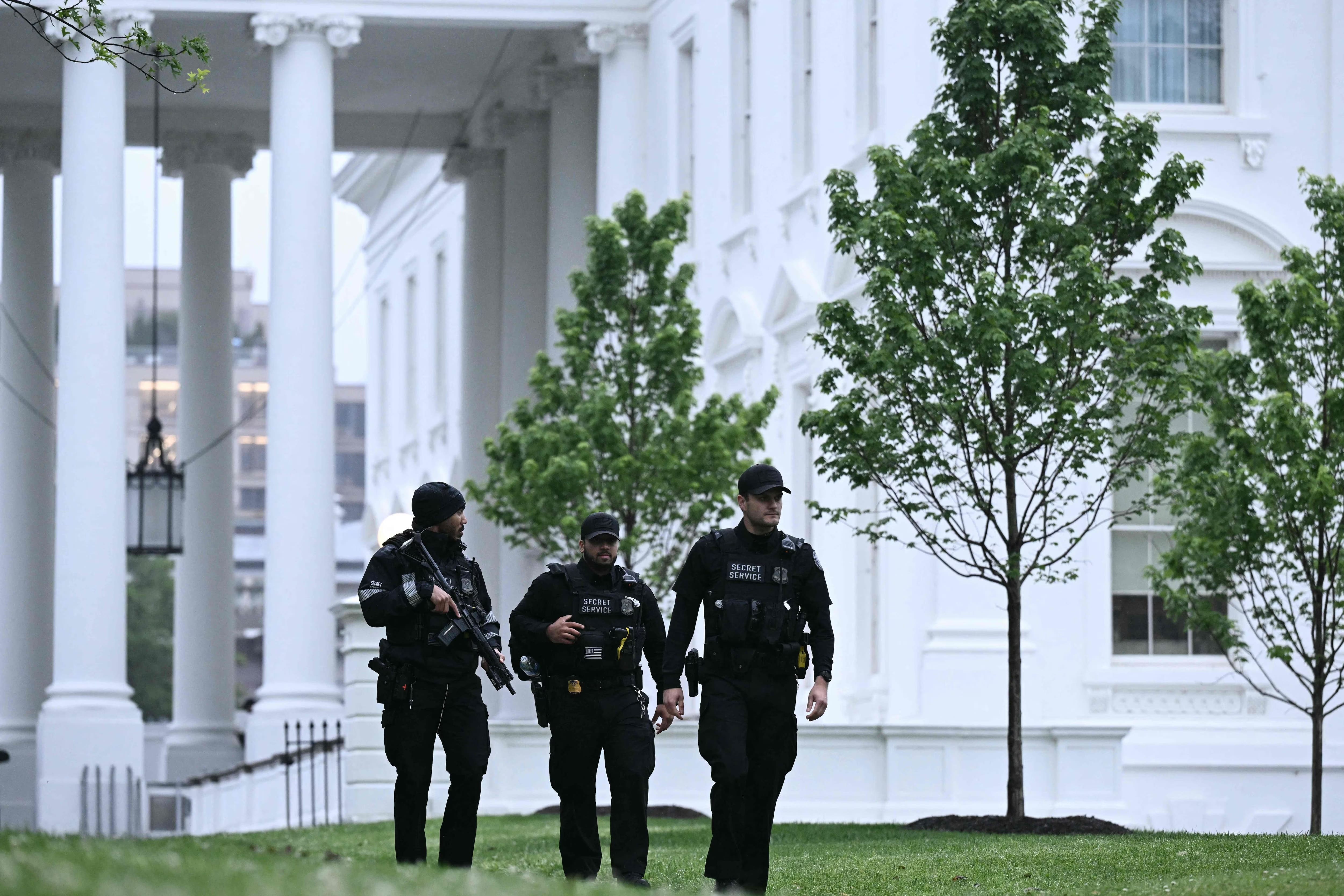 Armed Secret Service agents respond at the White House after gunshots